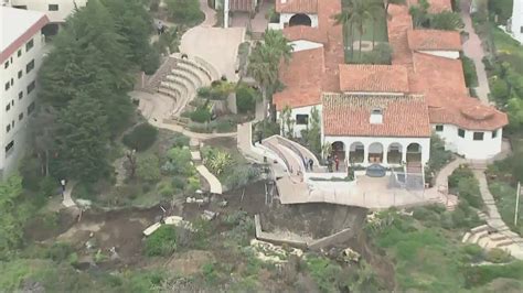 Hillside collapses under historic building in San Clemente; rail travel halted